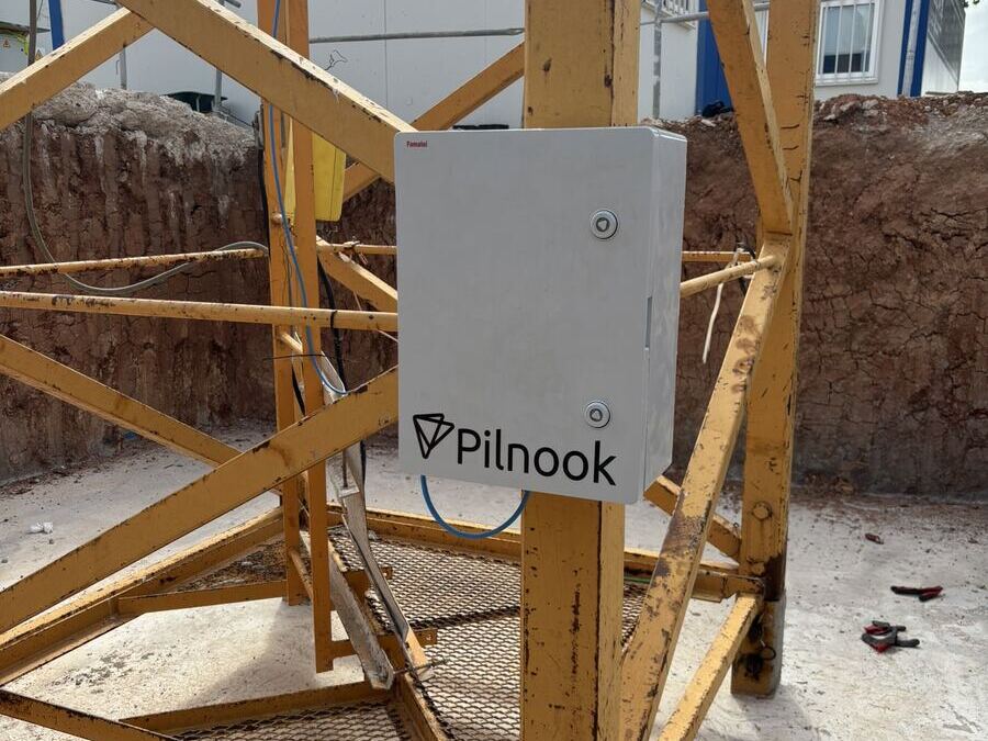 Pilnook cabinet mounted inside the base frame of a yellow crane